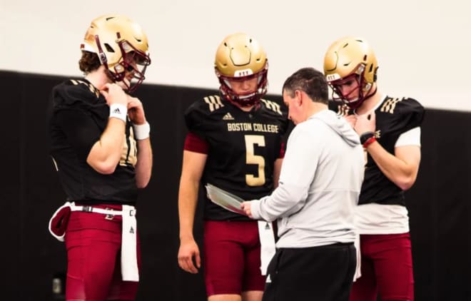 New offensive coordinator John McNulty talks with BC's quarterbacks during spring ball (Photo courtesy of BC Athletics).